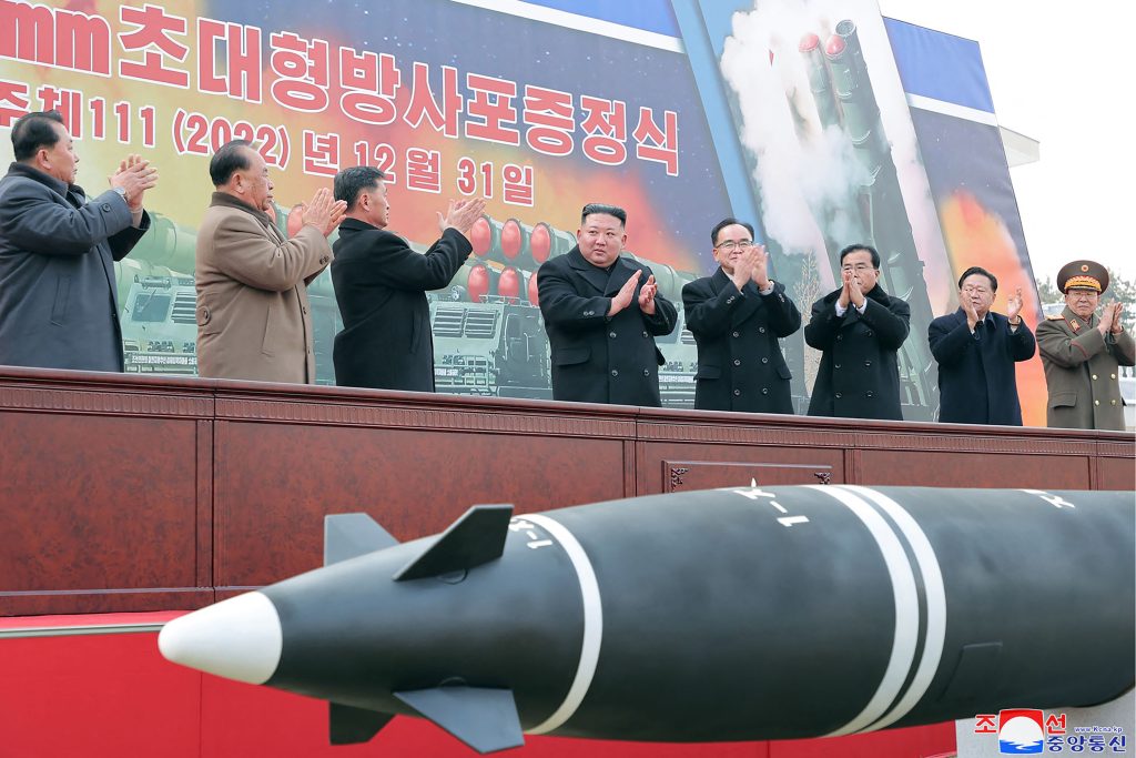This picture taken on December 31, 2022 and released from North Korea's official Korean Central News Agency (KCNA) on January 1, 2023 shows North Korean leader Kim Jong Un attending a ceremony of donating 600mm Super-large Multiple Launch Rocket System in the yard of the headquarters of the Central Committee of the Workers' Party of Korea in Pyongyang. (AFP)