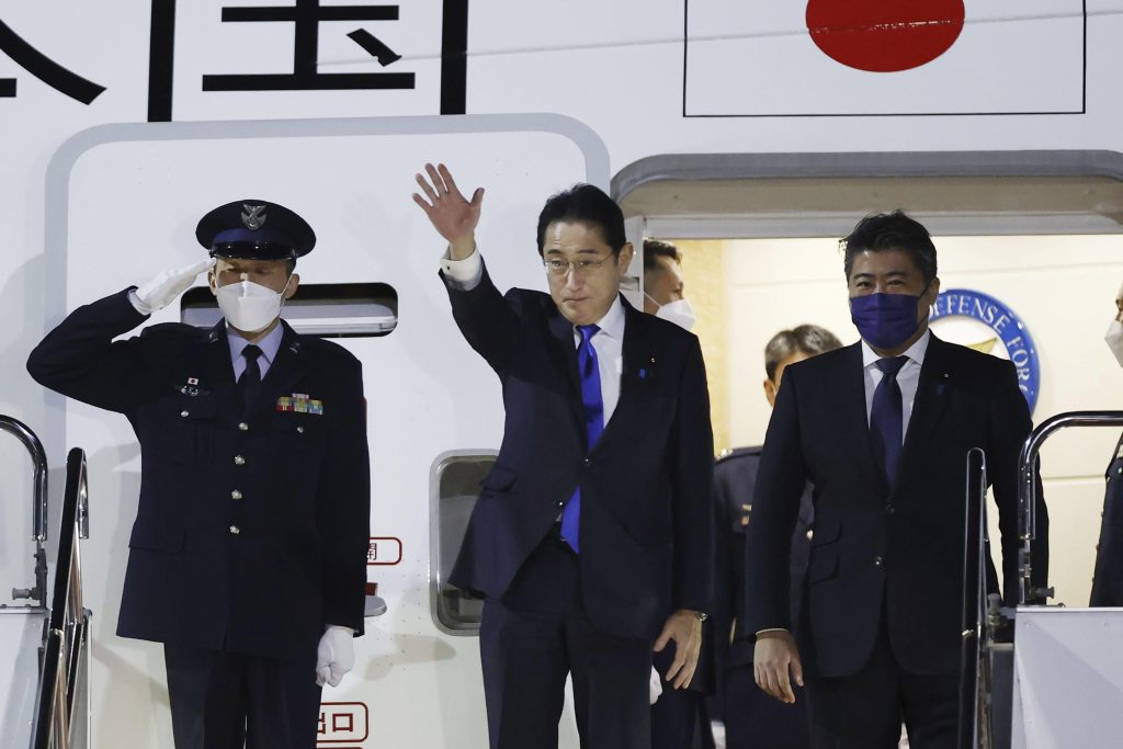 Japanese Prime Minister Fumio Kishida, center, prepares to leave Haneda airport in Tokyo, Jan. 8, 2023. (File/Kyodo News via AP)