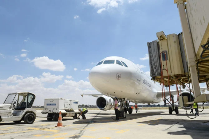 A Cham Wings Airlines Airbus A320-211 is pictured at the Syria's Aleppo airport after flights were diverted from Damascus aiport following an Israeli strike last week, on June 15, 2022. (AFP)