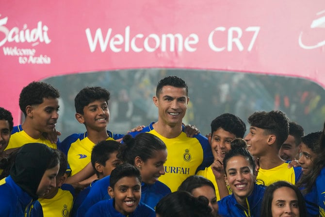 Cristiano Ronaldo smiles during his official unveiling as a new member of Al Nassr soccer club in in Riyadh, Saudi Arabia, Tuesday, Jan. 3, 2023. (AP)