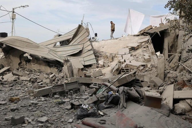 People inspect the rubble of a house that was demolished by Israeli soldiers, in the village of Kafr Dan in Jenin, in the occupied West Bank, on January 2, 2023. (AFP)