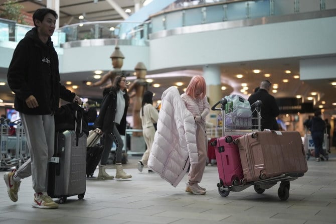 Canada require people flying from China, Hong Kong and Macao to test negative for COVID-19 before leaving for Canada, starting on Thursday, Jan. 5. (AP)