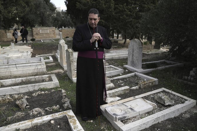 Vandals desecrated more than 30 graves at a historic Protestant Cemetery in Jerusalem. (AP)