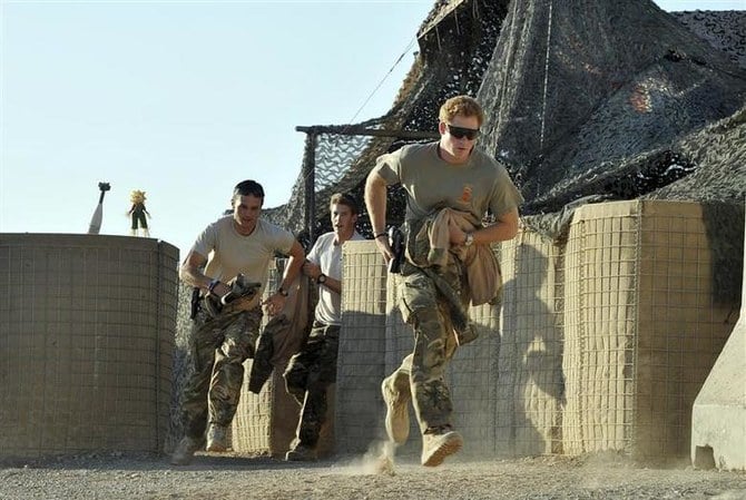 Prince Harry racing out from a VHR (very high readiness) tent with fellow crew members, to scramble his Apache helicopter at Camp Bastion, southern Afghanistan in 2012. (Reuters/File Photo)