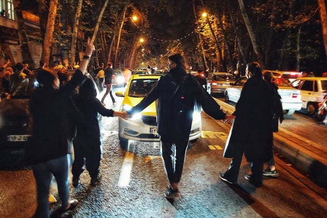 Women protest the death of 22-year-old woman Mahsa Amini who was detained by the morality police, in Tehran, Saturday, Oct. 1, 2022. in this photo taken by an individual not employed by the Associated Press and obtained by the AP outside Iran. (AP)