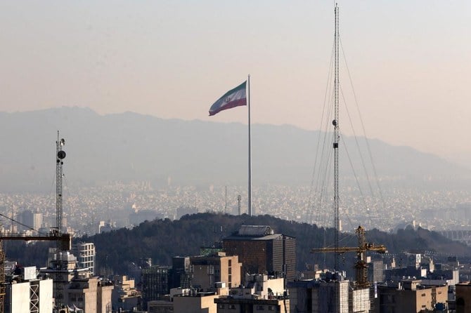 A general view shows the Iranian capital Tehran on January 7, 2023, with the Iranian flag waving in the wind. (AFP)