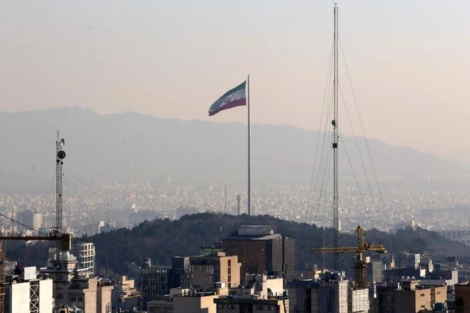 A general view shows the Iranian capital Tehran on January 7, 2023, with the Iranian flag waving in the wind. (AFP)