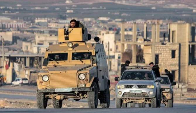 Turkiye-backed Syrian fighters deploy in vehicles in al-Bab in the northern rebel-held part of Syria's Aleppo province on January 3, 2023. (AFP)