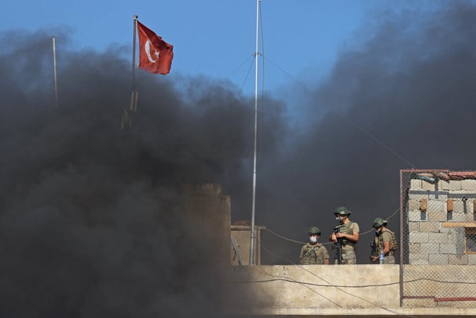 Turkish soldiers stand guard atop an outpost in the village of Balyun in the rebel-held southern countryside of Syria's northwestern province of Idlib on July 22, 2021. (AFP file photo)