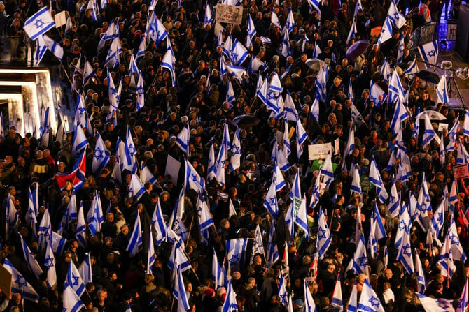 Israelis protest against Prime Minister Benjamin Netanyahu’s new right-wing coalition and its proposed judicial reforms to reduce powers of the Supreme Court in a main square in Tel Aviv on January 14, 2023. (Reuters)