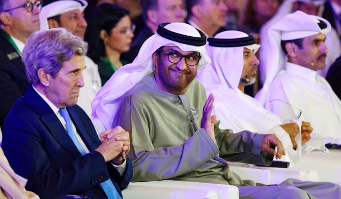 Sultan Ahmed Al-Jaber, CEO of the Abu Dhabi National Oil Company, and the US presidential envoy for climate, John Kerry, attend the Atlantic Council Global Energy Forum, in Abu Dhabi on Saturday. (AFP)