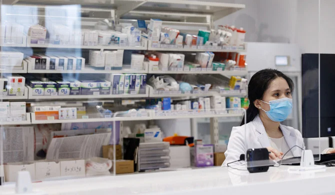 A pharmacist works at a clinic. (REUTERS)