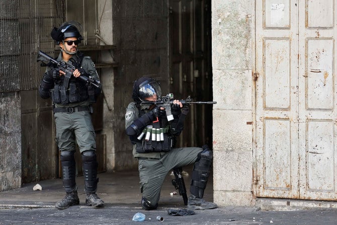 Israeli soldiers secure the scene after a Palestinian was shot and killed following an alleged attempted attack on an Israeli, next to Sde Efraim farm in the West Bank, on Jan. 21, 2023. (AP)