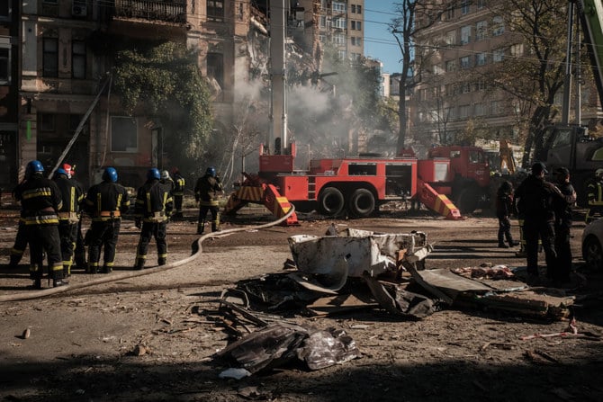 Firefighters struggle to halt a blaze after a Russian attack using Iranian drones destroyed a Kyiv residential building. (AFP)