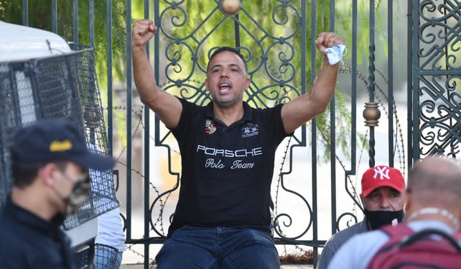 Tunisian parliament member and spokesperson the Al-Karama coalition Seifeddine Makhlouf gestures outside the Parliament which was cordoned-off by the military in the capital Tunis on July 26, 2021, following a move by the president to suspend the country's parliament and dismiss the Prime Minister. (AFP)