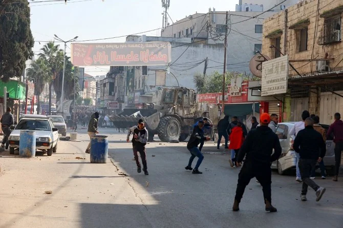 An Israeli raid on Thursday the West Bank's Jenin refugee camp today killed 8 Palestinians including an elderly woman, Palestinian officials said, also accusing the army of using tear gas inside a hospital.(AFP)