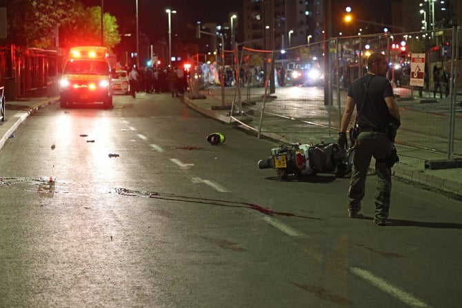 Israeli emergency personnel rush to the site of a reported attack in a settler neighborhood in Israeli-annexed East Jerusalem on January 27, 2023. (AFP)