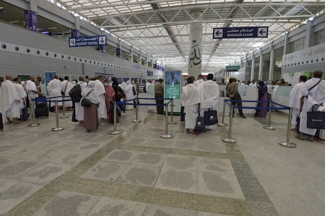 Hajj pilgrims go through passport control upon their arrival at King Abdulaziz International Airport in Saudi Arabia’s Red Sea coastal city of Jeddah. (File/AFP)