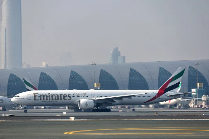 A picture taken on January 30, 2023 at Dubai airport, shows the first milestone demonstration flight on a Emirates Boeing 777-300ER. (AFP)