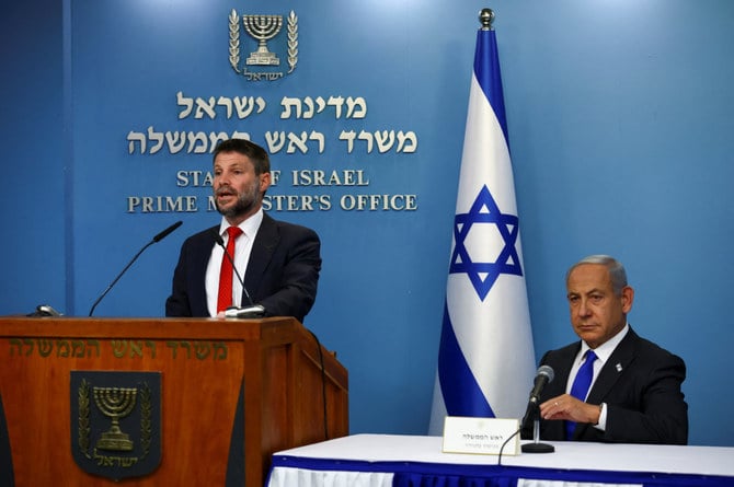 Israeli Finance Minister Bezalel Smotrich speaks as he and Benjamin Netanyahu hold a news conference in Jerusalem. (Reuters)