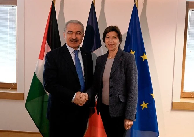 French Foreign and European Affairs Minister Catherine Colonna welcomes Palestinian Prime Minister Mohammad Shtayyeh before a meeting on the sidelines of a EU’s Foreign Affairs Council meeting in Brussels on Jan. 23, 2023. (AFP)