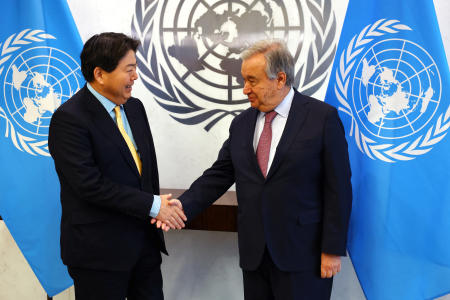 Japanese Foreign Minister Yoshimasa Hayashi and United Nations Secretary General Antonio Guterres shake hands at the UN headquarters in New York City, New York, US, January 12, 2023. (Reuters)