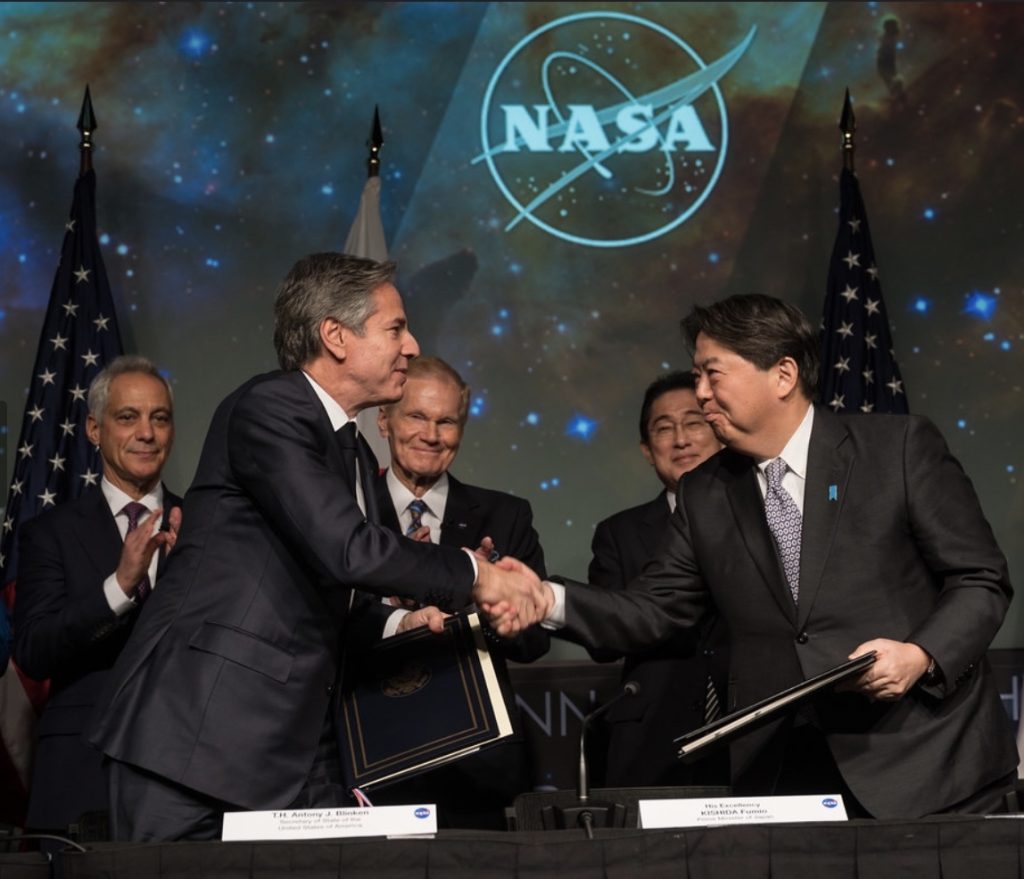 U.S. Secretary of State Antony Blinken, front left, and Japan’s Minister for Foreign Affairs, Hayashi Yoshimasa, front right, shake hands after signing an agreement on space exploration between the U.S. and Japan, Friday, Jan. 13, 2023, at the Mary W. Jackson NASA Headquarters building in Washington. (NASA)