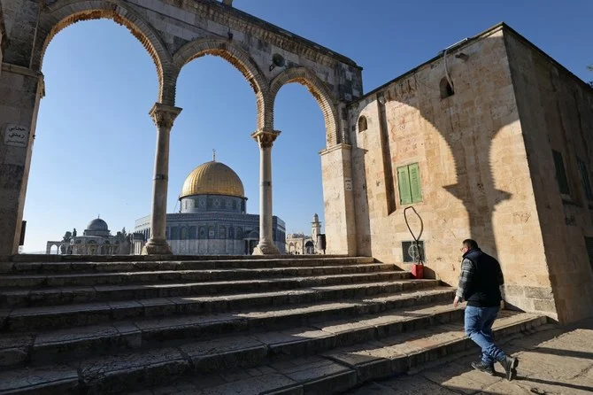 A Palestinian man walks toward the Dome of the Rock mosque in the Al-Aqsa mosque compound in Jerusalem’s Old City. (File/AFP)