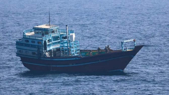 US service members conduct a boarding on a stateless fishing vessel transiting international waters the Gulf of Oman as a rigid-hull inflatable boat and patrol coastal ship USS Chinook (PC 9) sail nearby. (US Navy)