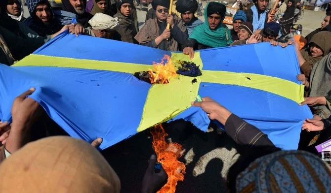 Protesters burn the Swedish flag, Kandahar, Afghanistan, Jan. 25, 2023. (AFP)