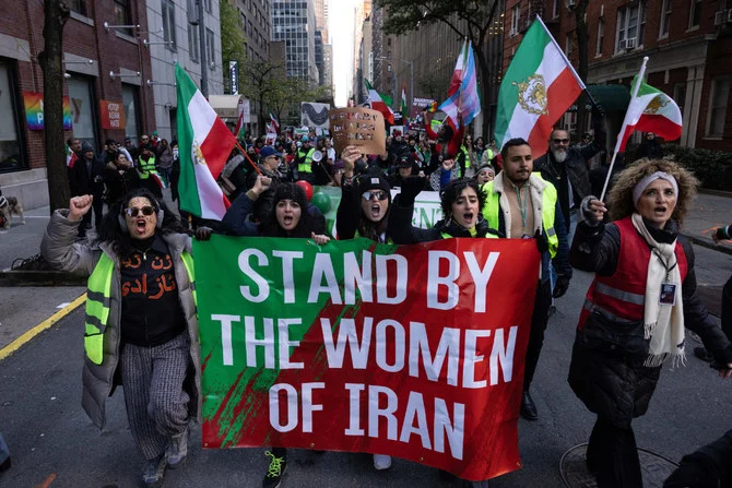 Protesters call on the UN to take action against the treatment of women in Iran on Nov. 19, 2022. (AFP file)
