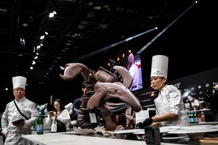 Team Japan’s Moe Takahashi (right) prepares a creation as she competes in the 2023 Bocuse d’Or pastry competition at the SIRHA (Salon International de la Restauration, de l’Hôtellerie et de l’Alimentation) in Chassieu Eurexpo hall near Lyon, southeastern France, on January 21, 2023. (AFP)