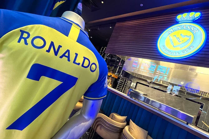 A picture shows the jersey of Portuguese football star Cristiano Ronaldo, Al-Nassr's new forward, at Al-Nassr Cafe in the Boulevard entertainment city of Riyadh, on January 17, 2023. (AFP)