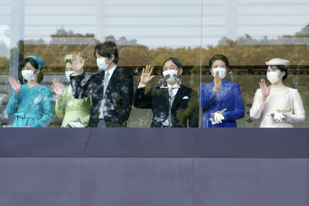 Japan's Emperor Naruhito, Empress Masako (2nd-R), their daughter Princess Aiko (R), Crown Prince Akishino (3rd-L), Crown Princess Kiko (2nd-L) and their daughter Princess Kako wave from the balcony of the Imperial Palace to mark the emperor's 63th birthday in Tokyo on February 23, 2023. (AFP)