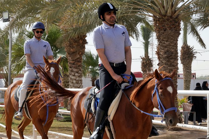 Saudi blind men, jockey BadrA-Sharari (R) and Abdul Rahman Al-Otaibi ride horses during a training session at Medhal equestrian centre in eastern Riyadh. AFP