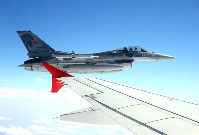 In this photo taken on July 15, 2017, an F-16 fighter jet of the Turkish air force flies on the wing of President Recep Tayyip Erdogan's plane as he traveled from Ankara to Istanbul. (AFP file)