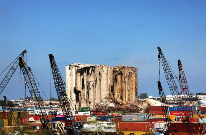 This photo taken on August 12, 2022 shows a part of the middle grain silos in the port of Beirut which collapsed that week following the damage caused by the August 4, 2020 massive explosion that hit the Lebanese harbor. (AFP)