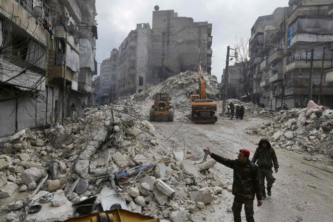 Syrian rescue teams search for victims and survivors in the city of Hama following a deadly earthquake on February 6, 2023. (AFP)