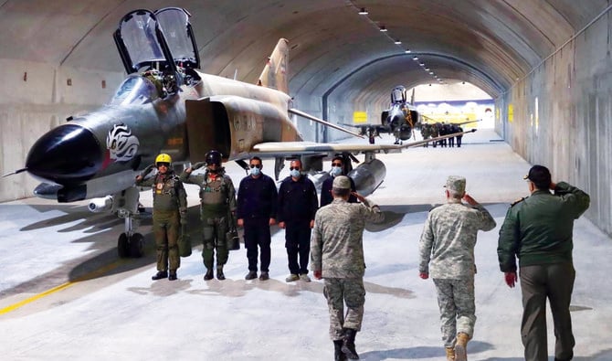 Iranian military officials visit the country’s first underground air force base, called ‘Eagle 44’ at an undisclosed location. (Reuters)