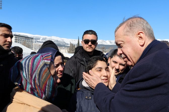 Turkish President Tayyip Erdogan meets with people in the aftermath of a deadly earthquake in Kahramanmaras, Turkiye, on February 8, 2023. (AFP)