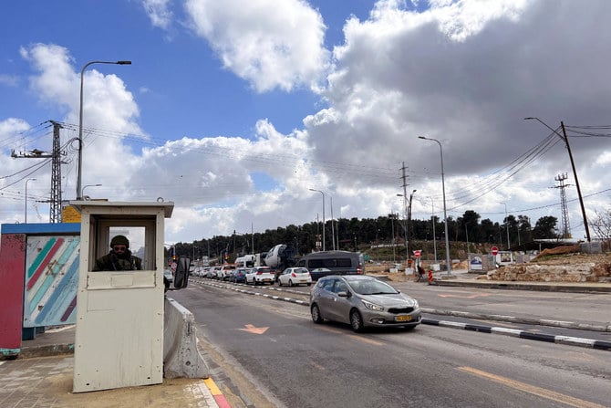 An Israeli soldier stands guard at Gush Etzion Junction in the Gush Etzion settlements compound in the Israeli-occupied West Bank on Feb. 2, 2023. (REUTERS/Dedi Hayun)