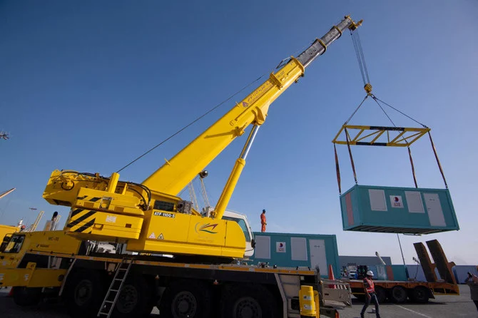 One of a batch of mobile home cabins that Qatar has allocated to be transferred to Turkiye is transported in Hamad Port on Feb. 12, 2023. (Qatar Fund for Development via Reuters)