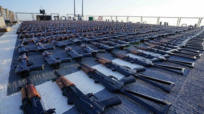 Above, thousands of AK-47 assault rifles on the flight deck of guided-missile destroyer USS The Sullivans during an inventory process, after they were seized from a fishing vessel in international waters of the Gulf of Oman. (NAVCENT Public Affairs/US Navy/AFP)