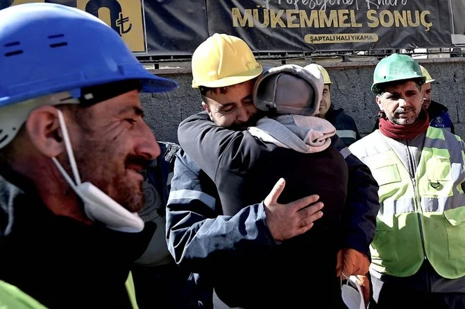 The uncle of Aleyna Olmez (C), reacts after the 17-year-old woman was rescued from a collapsed building, 248 hours after the 7.8-magnitude earthquake which struck parts of Turkey and Syria, in Kahramanmaras (AFP)