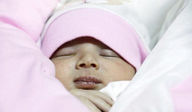 A baby girl, who was born during a deadly earthquake earlier this month, is carried by her uncle-by-marriage Khalil Al-Sawadi, after her parents and siblings died in the disaster, in the rebel-held town of Jandaris, Syria February 18, 2023. (REUTERS)