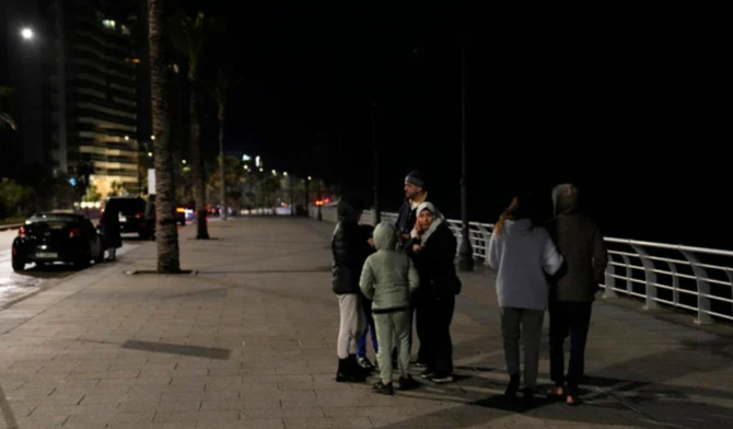 A family stayed outside after an earthquake hit neighboring Turkiye on Feb. 6, 2023, in Beirut, Lebanon. (AP/File)