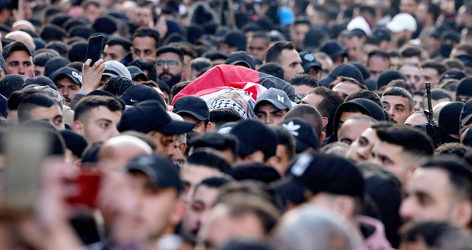 Mourners carry the body of a Palestinian killed earlier in a raid by Israeli forces on the occupied-West Bank city of Nablus. (AFP)