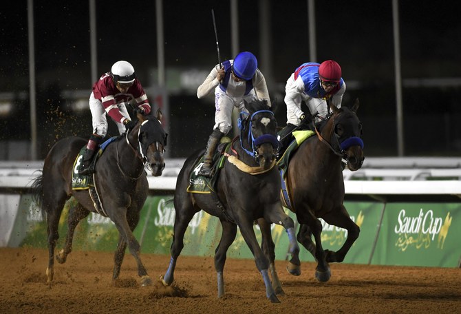 Emblem Road (right) on the way to victory at the Saudi Cup last year. (Supplied)