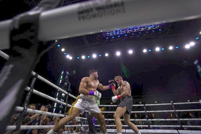 British boxer Tommy Fury, left, won a split decision win against American social media star Jake Paul. (Abdulrhman Binshalhuob/AN)