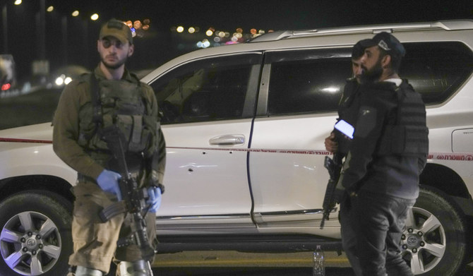 Israeli security forces examine the scene of a shooting attack near the West Bank city of Jericho, Monday, Feb. 27, 2023. (AP)